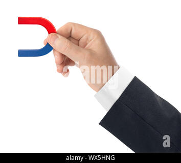 Hand with magnet Stock Photo