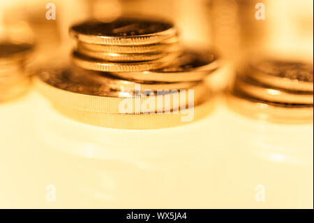 Stack of gold coins macro. Rows of coins for finance and banking concept. Economy trends background. Stock Photo