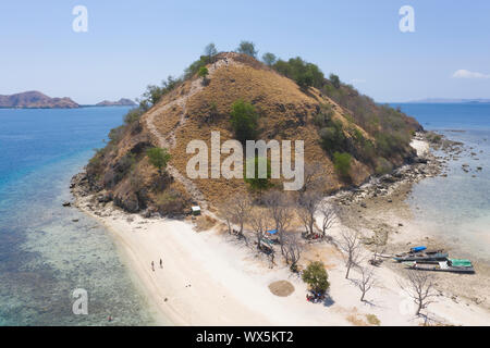 Aerial view by drone the beautiful Kelor Island with beautiful landscape, sandy beach, blue ocean, coral reef and and mountain located in Labuan Bajo, Stock Photo