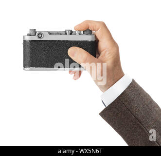 Vintage photo camera in hand Stock Photo