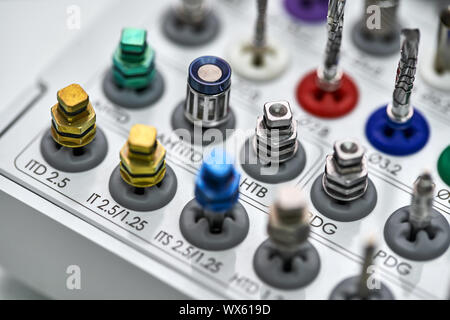 Different sizes steel drills and tools for dental prosthetic. Macro horizontal photo. Stock Photo