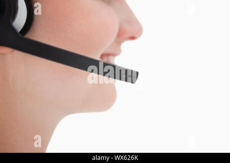 Headset being used by call center agent against a white background Stock Photo