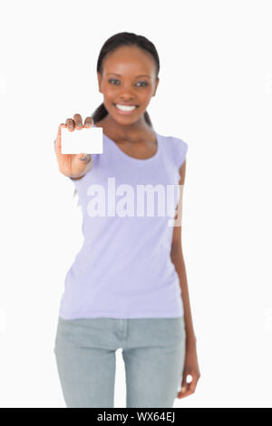 Business card being presented by smiling woman on white background Stock Photo