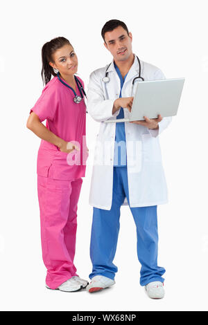 Portrait of doctors using a laptop against a white background Stock Photo