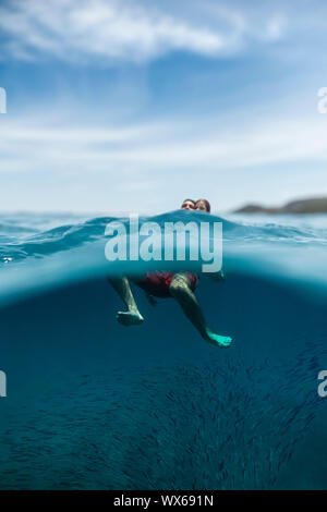 A couple swimming in the open sea Stock Photo