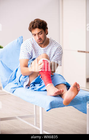 Injured man waiting treatment in the hospital Stock Photo