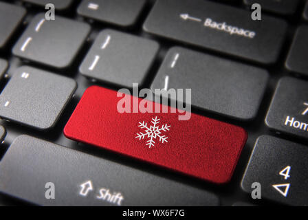 Christmas key with snowflake icon on laptop keyboard. Included clipping path, so you can easily edit it. Stock Photo