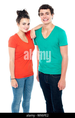 Adorable teenage couple in casuals isolated on white background Stock Photo