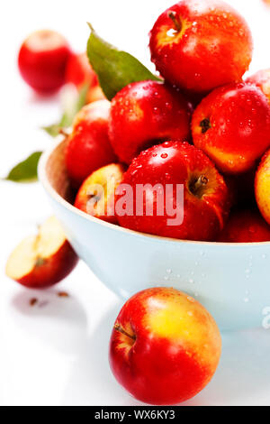 Fresh apples in a bowl over white Stock Photo