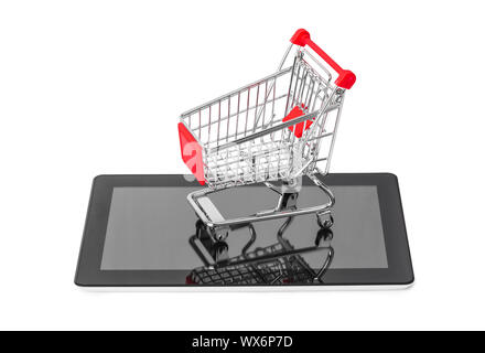 Tablet pc and shopping cart Stock Photo