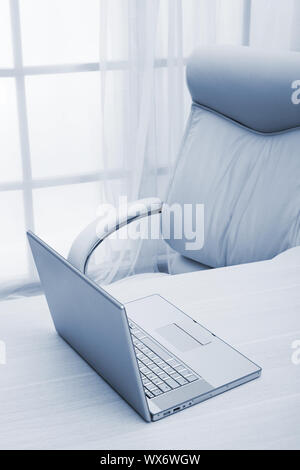 laptop on a table at modern office Stock Photo