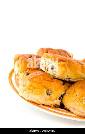 bread rolls filled with currants on a plate Stock Photo