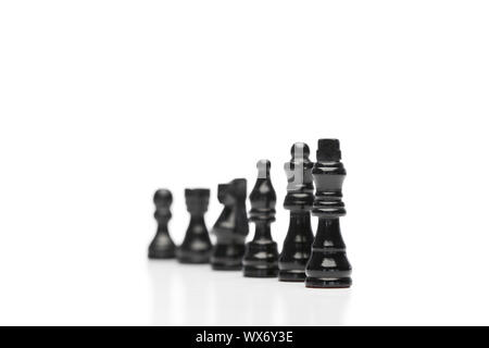 Black pieces of chess on a white background