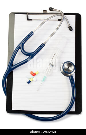 Note pad with blue stethoscope and pills on a white background Stock Photo