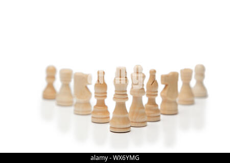 White pieces of chess on a white background