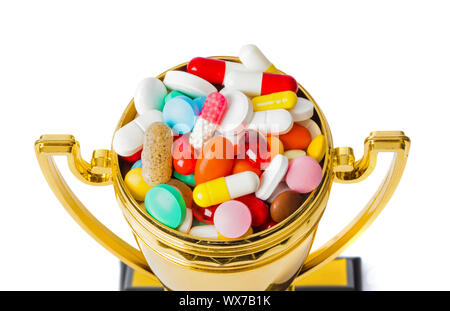 Golden trophy cup with pills Stock Photo