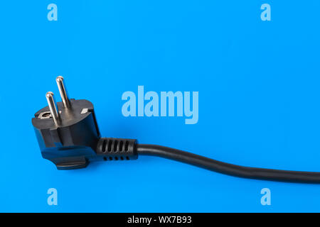 Electrical plug on blue background Stock Photo
