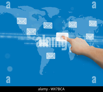 Finger touching message symbol against blue world map touchscreen interface with binary code Stock Photo