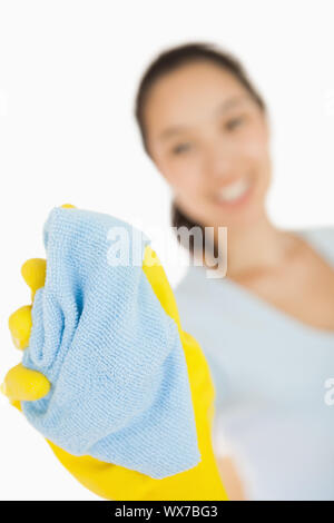 Happy woman cleaning window on white background Stock Photo
