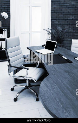 workplace with laptop in office Stock Photo
