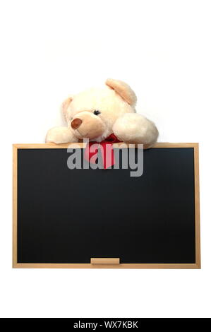 isolated teddy with empty blackboard on white background Stock Photo