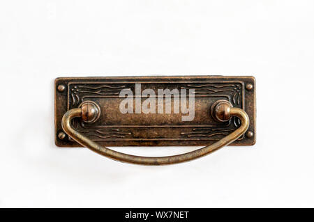 Copper brass handle of a cupboard Stock Photo