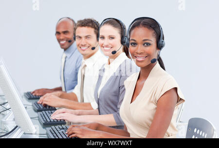 International customer service representatives using headset in a call-center Stock Photo