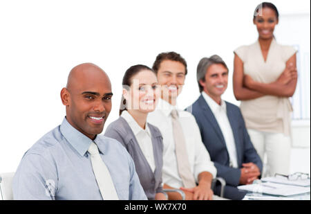 Self-assured multi-ethnic business group at a presentation in the office Stock Photo