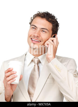 Young businessman on phone while drinking a coffee against a white background Stock Photo