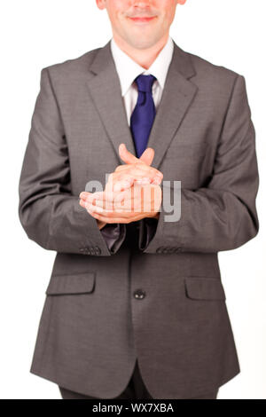 Isolated and smiling businessman clapping against white background Stock Photo