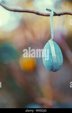 Easter eggs on tree with bokeh Stock Photo