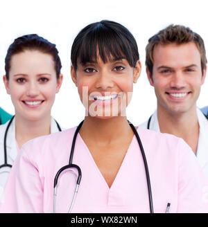 Portrait of a doctor and her medical team against a white background Stock Photo