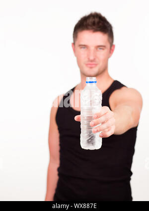 Young Happy Sportsman holding water bottle Stock Photo