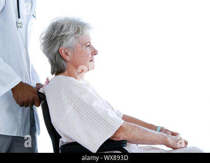 Portrait of a senior woman sitting on a wheelchair in a hospital Stock Photo