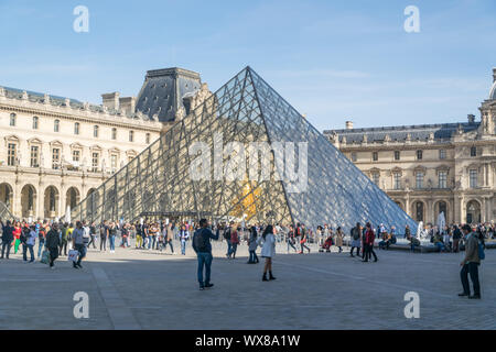 PARIS, FRANCE - 02 OCTOBER 2018:People in front famous pyramid of Louvre museum . Stock Photo