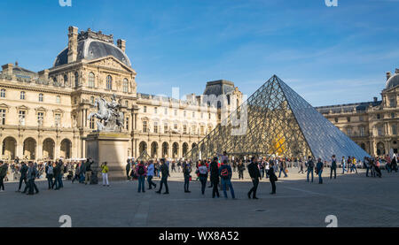 PARIS, FRANCE - 02 OCTOBER 2018:People in front famous pyramid of Louvre museum . Stock Photo