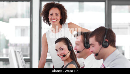 Happy business partners working with their manager Stock Photo