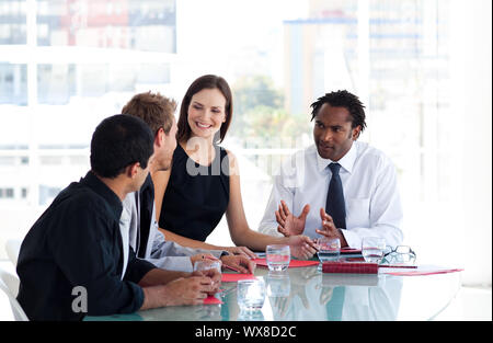 International business team interacting to each other in office Stock Photo