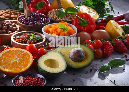 Composition with assorted organic food products on wooden kitchen table Stock Photo