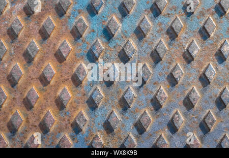 Closeup of a rusty manhole cover Stock Photo