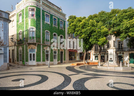 Green glazed tile building on the Luis de Camoes Square in Lagos, Portugal Stock Photo