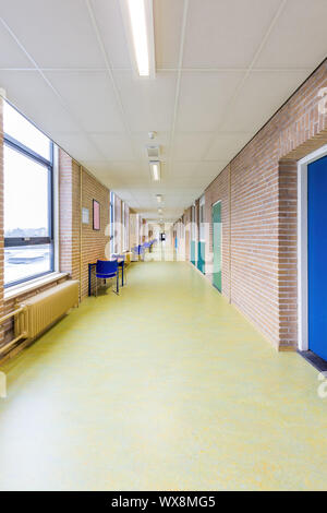Long straight empty corridor in secondary school building Stock Photo