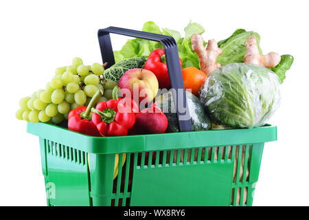 Fresh organic fruits and vegetables in plastic shopping basket isolated on white Stock Photo