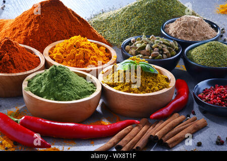 Variety of spices on kitchen table. Stock Photo