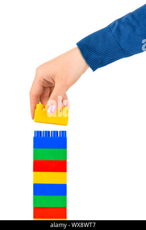 Hand and toy tower Stock Photo