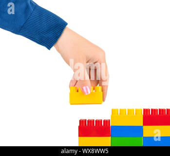 Hand and toy wall Stock Photo