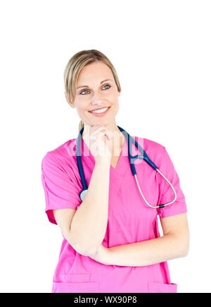 Thoughtful female doctor smiling at the camera against a white background Stock Photo