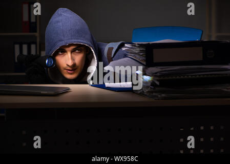 Thief trying to steal personal data in identity theft concept Stock Photo