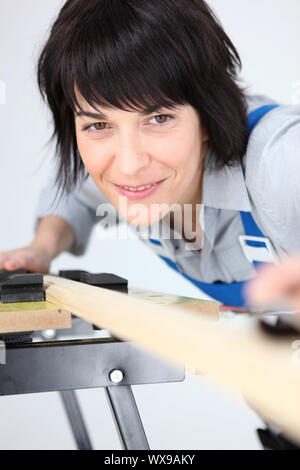 Woman using workbench Stock Photo