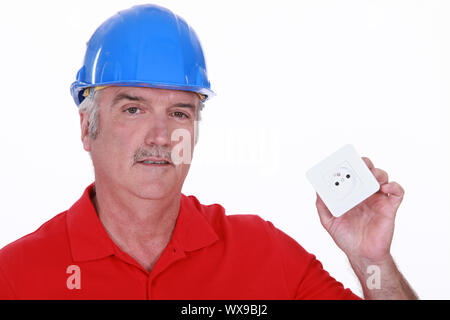 Builder with a continental power socket Stock Photo